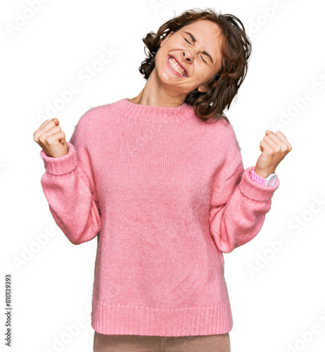 Young hispanic woman wearing casual clothes very happy and excited doing winner gesture with arms raised, smiling and screaming for success. celebration concept.