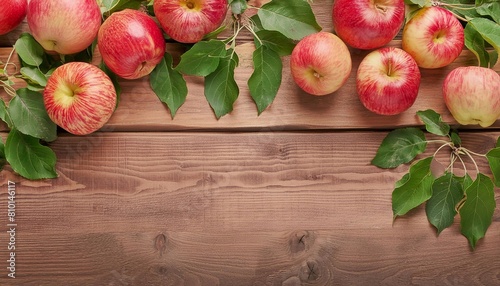 apples on a wooden background with space for text. view from above © Kseniia