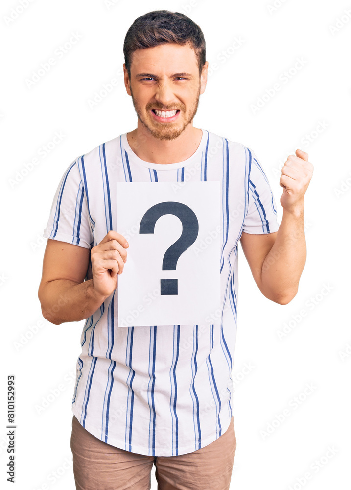 Handsome young man with bear holding question mark annoyed and ...