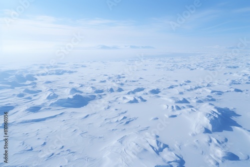 Vast snowy landscape under a clear blue sky © Balaraw