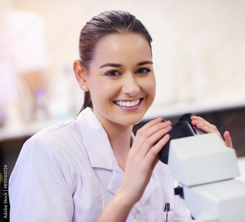 Girl, portrait and scientist in laboratory with microscope for medical samples to diagnose disease and chemistry. Woman, happy and lab equipment for science experiment or pharmaceutical research test