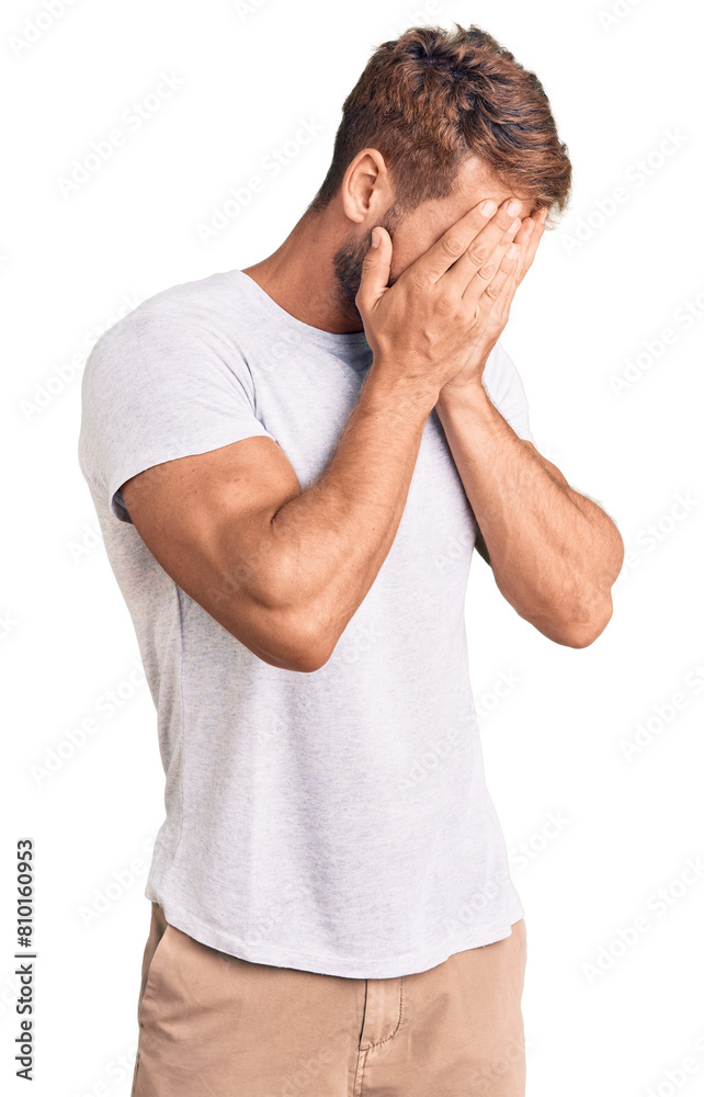 Young caucasian man wearing casual white tshirt with sad expression covering face with hands while crying. depression concept. Young caucasian man wearing casual white tshirt with sad expression covering face with hands while crying. depression concept.