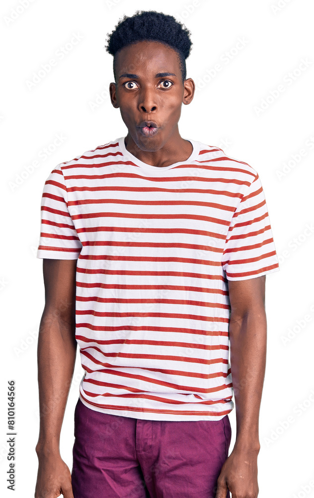 Young african american man wearing casual clothes afraid and shocked with surprise expression, fear and excited face. Young african american man wearing casual clothes afraid and shocked with surprise expression, fear and excited face.