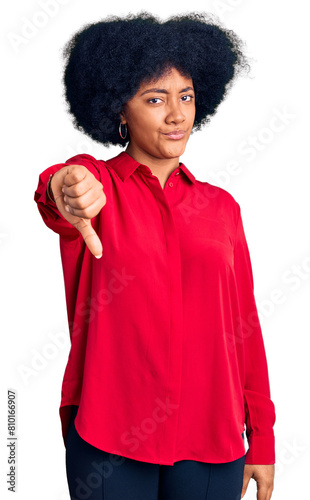 Young african american girl wearing casual clothes looking unhappy and angry showing rejection and negative with thumbs down gesture. bad expression.