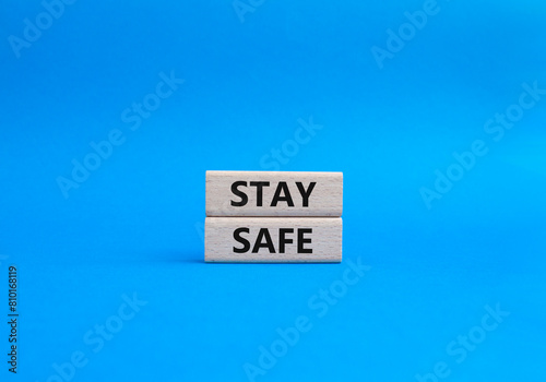 Stay Safe symbol. Concept word Stay Safe on wooden blocks. Beautiful blue background. Business and Stay Safe concept. Copy space