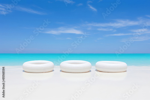 white swim ring  lifebuoy on white sand beach