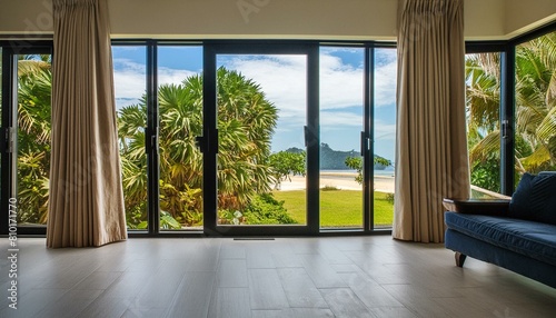 Modern home empty living room interior and panoramic window on tropics © Hazim