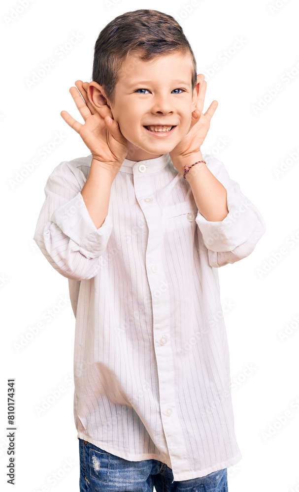 Cute blond kid wearing elegant shirt trying to hear both hands on ear gesture, curious for gossip. hearing problem, deaf Cute blond kid wearing elegant shirt trying to hear both hands on ear gesture, curious for gossip. hearing problem, deaf