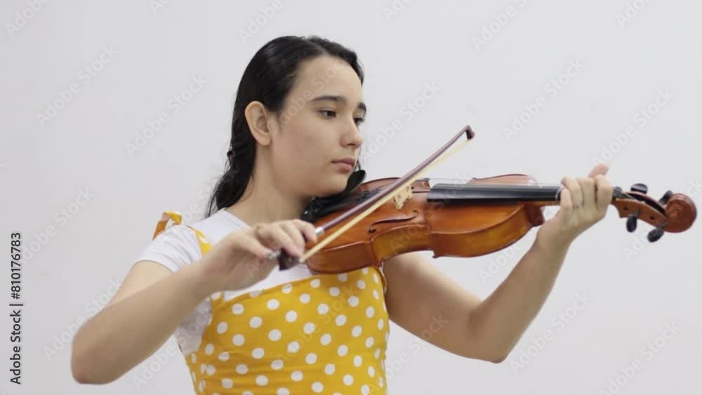 little girl playing her violin - shot zoom in little girl playing her violin - shot zoom in