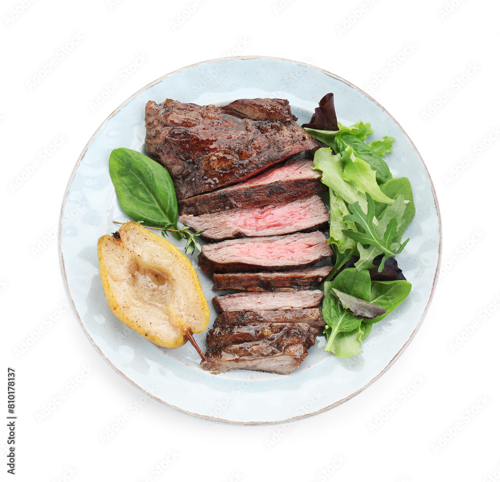 Pieces of delicious roasted beef meat, caramelized pear and greens isolated on white, top view Pieces of delicious roasted beef meat, caramelized pear and greens isolated on white, top view