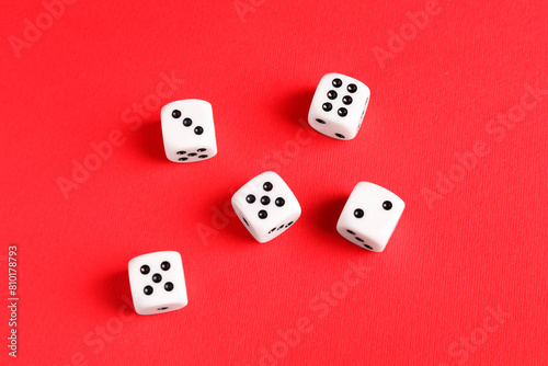 Many white game dices on red background  flat lay