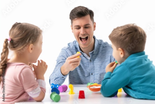Man Playing With Children at Table photo