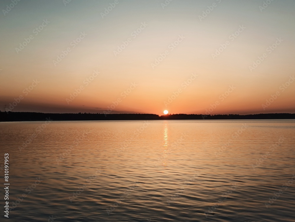 Calm warm orange sunset on the ocean. Calm warm orange sunset on the ocean.