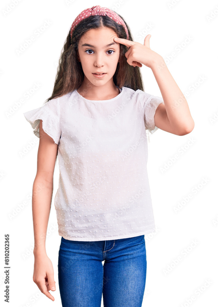Cute hispanic child girl wearing casual white tshirt pointing unhappy to pimple on forehead, ugly infection of blackhead. acne and skin problem Cute hispanic child girl wearing casual white tshirt pointing unhappy to pimple on forehead, ugly infection of blackhead. acne and skin problem