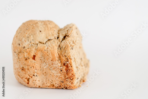 A piece of bread is sitting on a white background