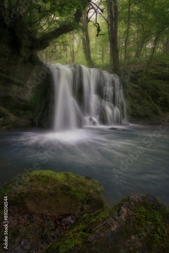 Waterfall of Altube inside a beech forest in the province of Alava, in the Basque Country, on a spring morning