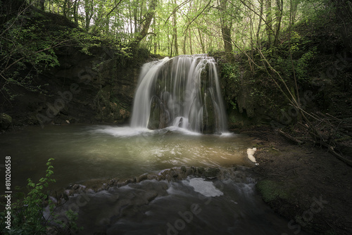 Waterfall of Altube inside a beech forest in the province of Alava  in the Basque Country  on a spring morning