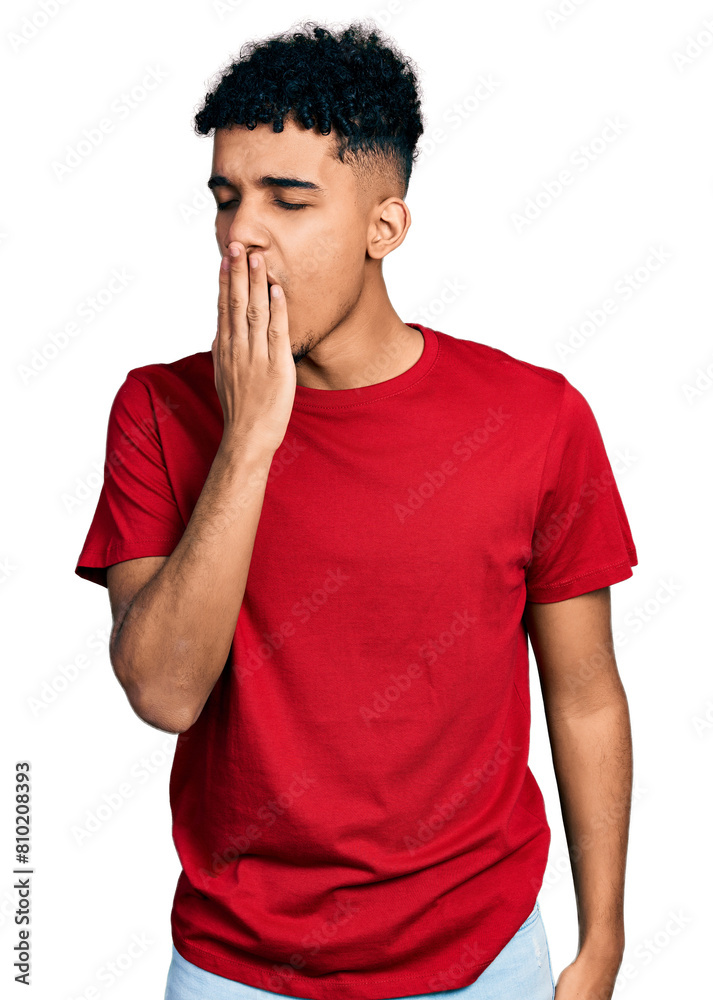 Young african american man wearing casual red t shirt bored yawning tired covering mouth with hand. restless and sleepiness. Young african american man wearing casual red t shirt bored yawning tired covering mouth with hand. restless and sleepiness.