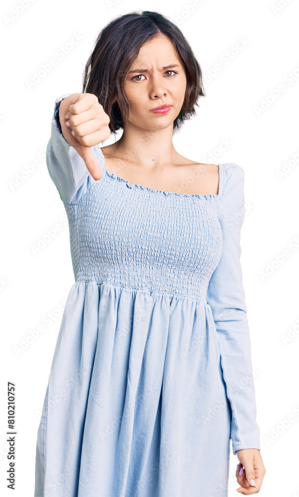 Young beautiful girl wearing casual clothes looking unhappy and angry showing rejection and negative with thumbs down gesture. bad expression. Young beautiful girl wearing casual clothes looking unhappy and angry showing rejection and negative with thumbs down gesture. bad expression.