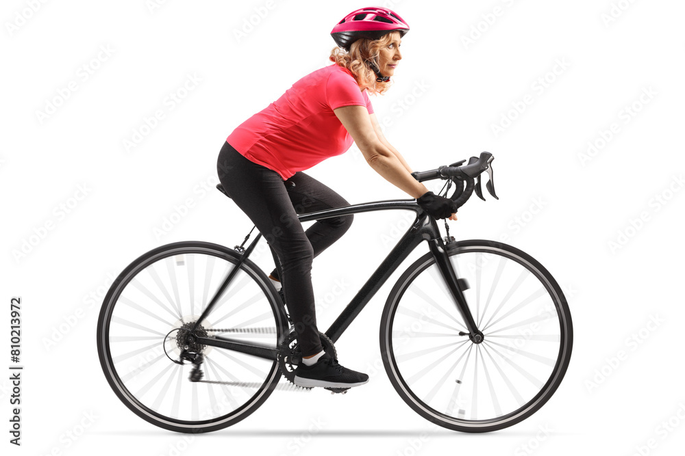 Woman in sportswear riding a bicycle with a helmet Woman in sportswear riding a bicycle with a helmet