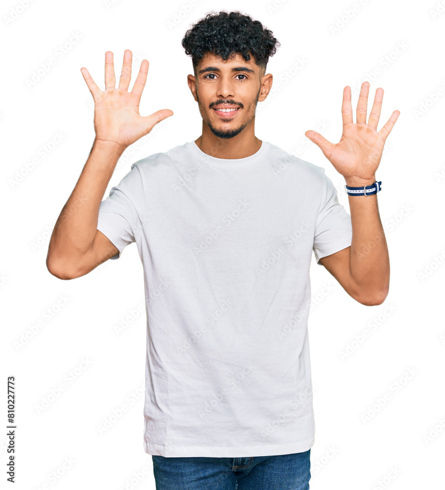 Naklejka premium Young arab man wearing casual white t shirt showing and pointing up with fingers number nine while smiling confident and happy.