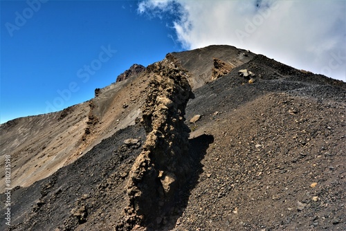 The ridge of Mount Meru, a dormant stratovolcano and the second highest mountain in Tanzania (4562 m), as seen during the morning ascent from Rhino Point (Arusha National Park, Tanzania) photo
