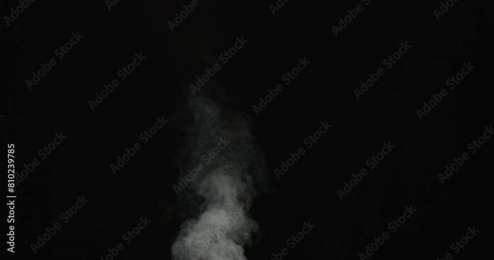 Rising White Smoke Against Black Background Rising White Smoke Against Black Background