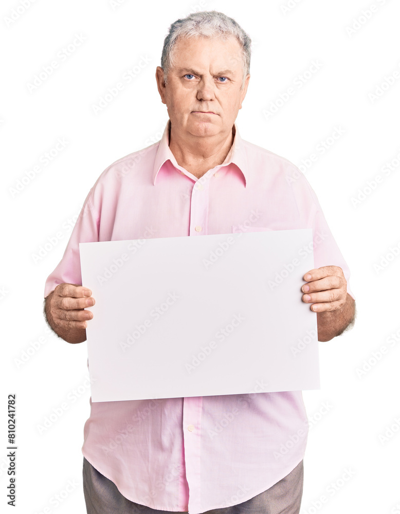 Senior grey-haired man holding blank empty banner thinking attitude and sober expression looking self confident Senior grey-haired man holding blank empty banner thinking attitude and sober expression looking self confident