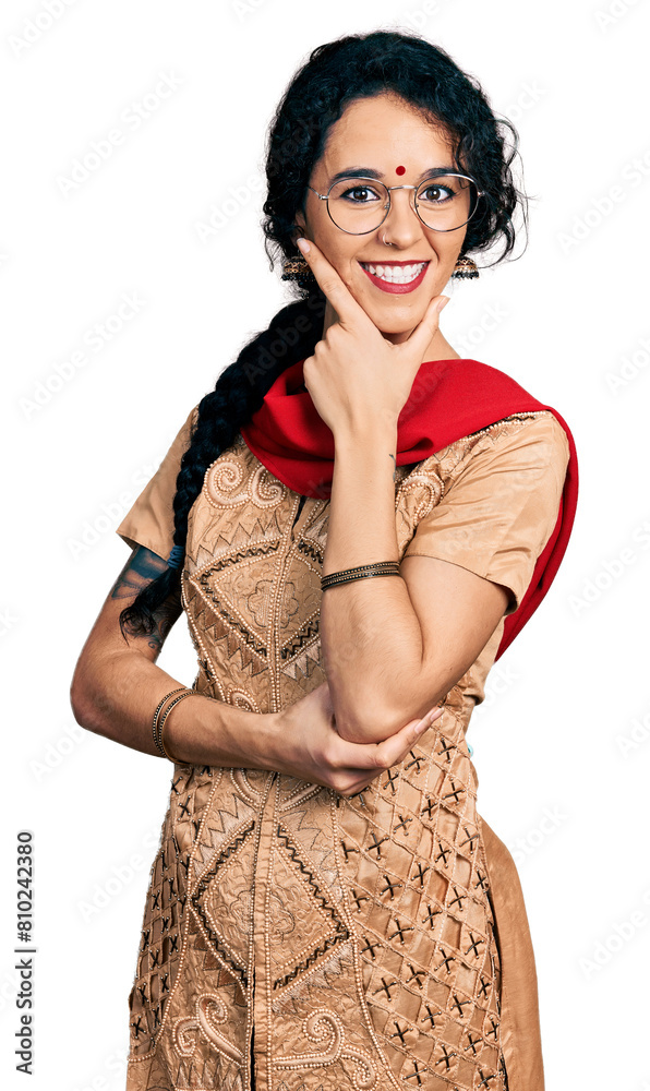 Young indian woman wearing traditional dress and glasses looking ...