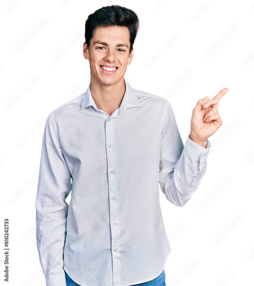 Young hispanic business man wearing business clothes with a big smile on face, pointing with hand and finger to the side looking at the camera. Young hispanic business man wearing business clothes with a big smile on face, pointing with hand and finger to the side looking at the camera.