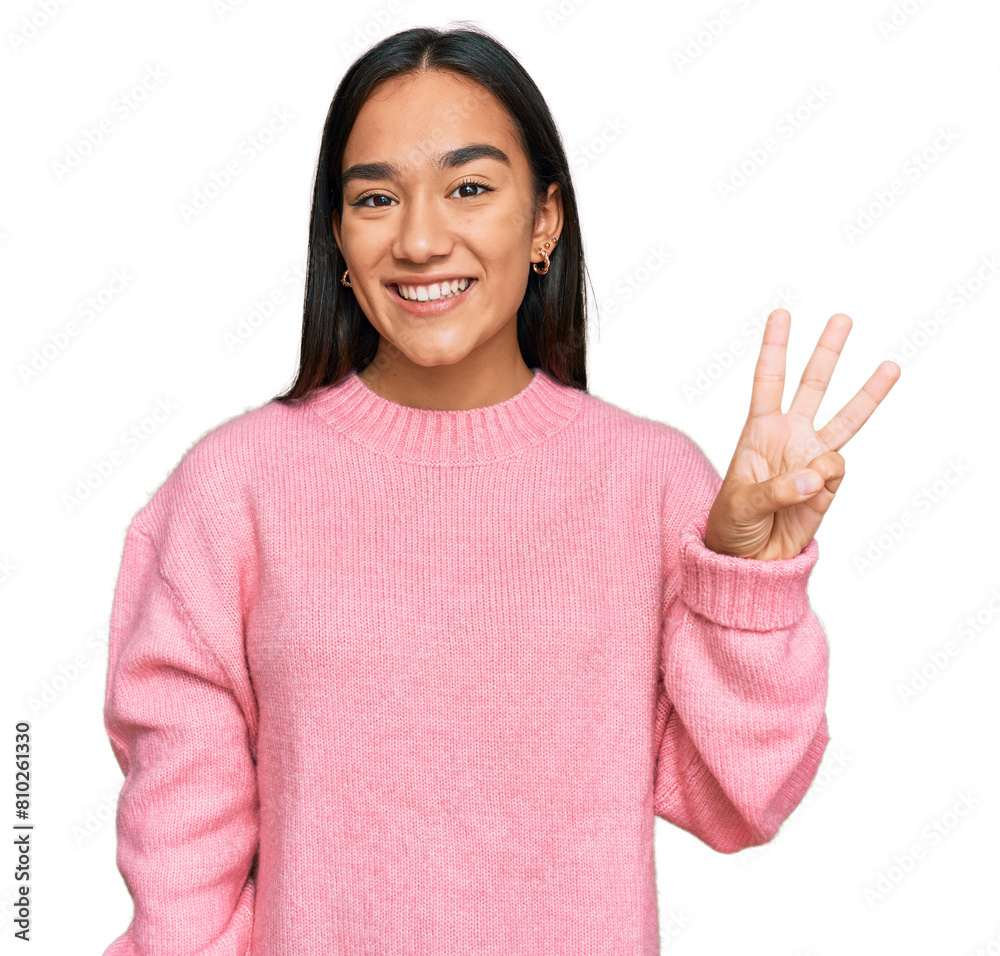 Young asian woman wearing casual winter sweater showing and pointing up with fingers number three while smiling confident and happy. Young asian woman wearing casual winter sweater showing and pointing up with fingers number three while smiling confident and happy.