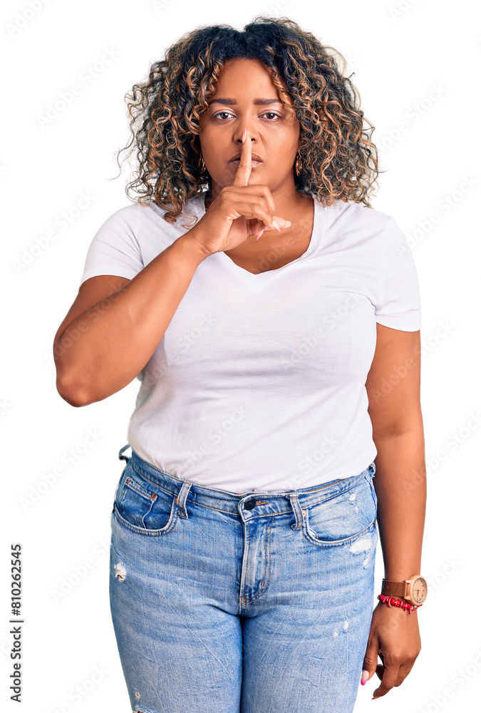 Young african american plus size woman wearing casual clothes asking to be quiet with finger on lips. silence and secret concept. Young african american plus size woman wearing casual clothes asking to be quiet with finger on lips. silence and secret concept.
