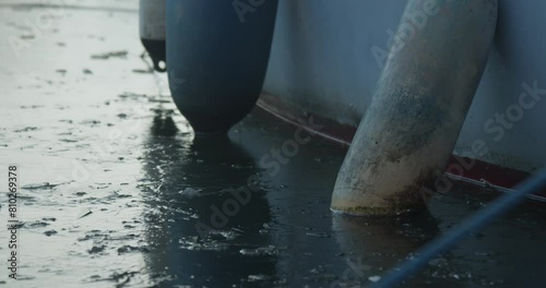 Close-Up Of Boat In Frozen Water With Fenders photo