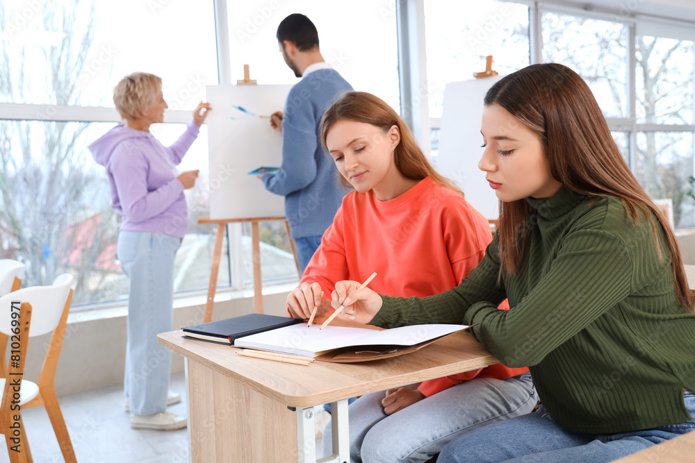 Female students drawing in art school Female students drawing in art school