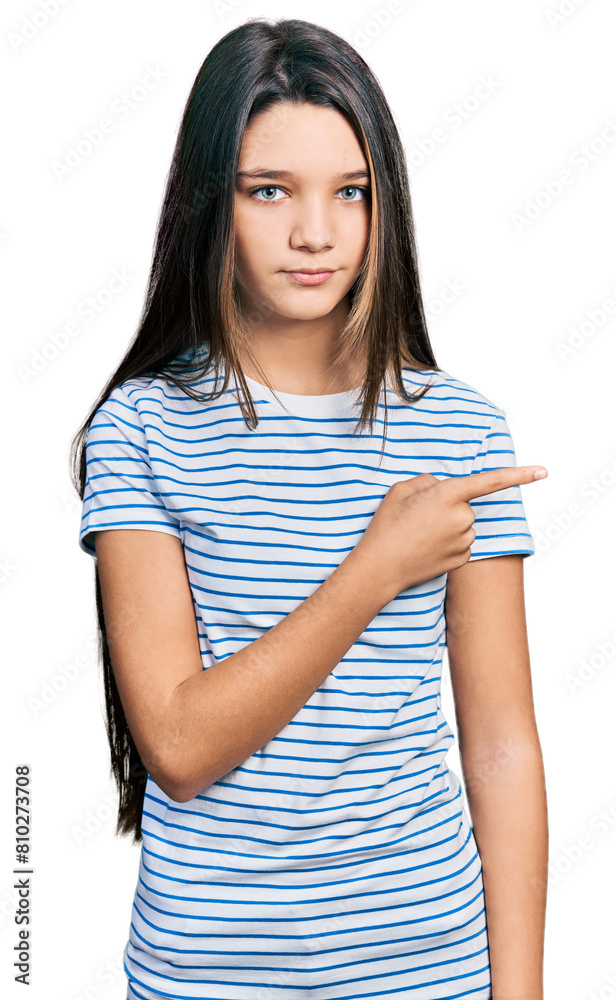 Young brunette girl with long hair pointing with fingers to the side skeptic and nervous, frowning upset because of problem. negative person. Young brunette girl with long hair pointing with fingers to the side skeptic and nervous, frowning upset because of problem. negative person.