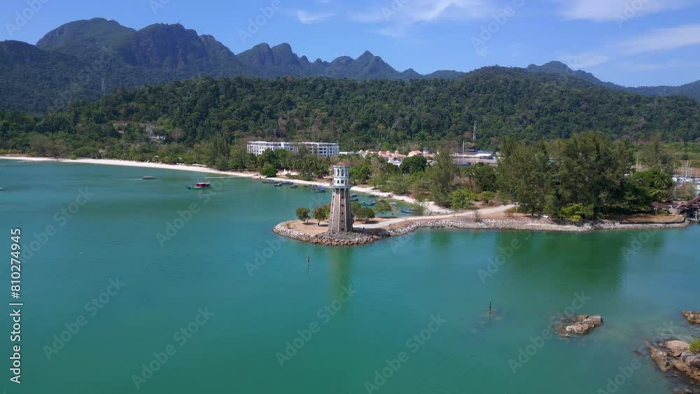 Coastal lighthouse overlooking tropical beach. Unbelievable aerial view drone Coastal lighthouse overlooking tropical beach. Unbelievable aerial view drone