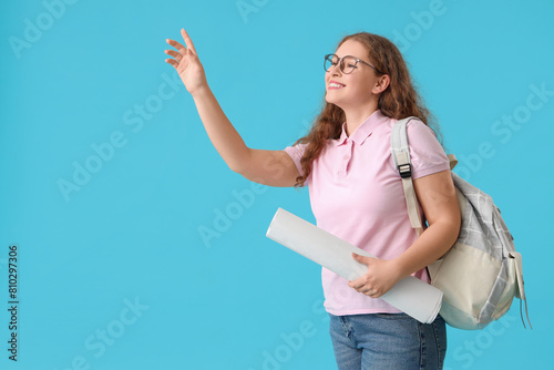 Happy female student with b...