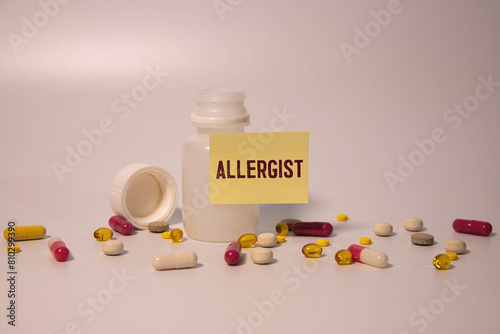 a doctor showing a signboard with the word allergy written in it photo