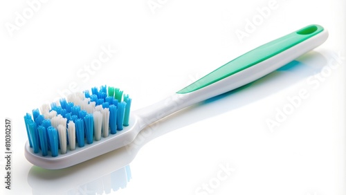 Close-up image of a toothbrush with white and blue bristles on a clean, bright white background