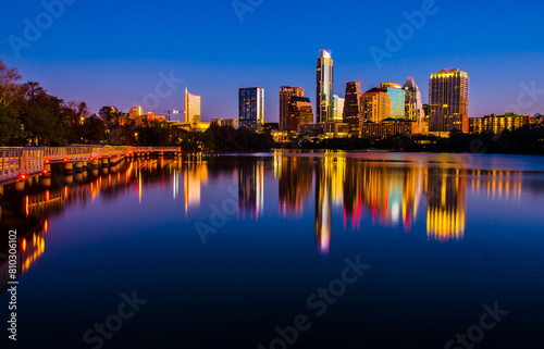 Twilight cityscape reflection over water