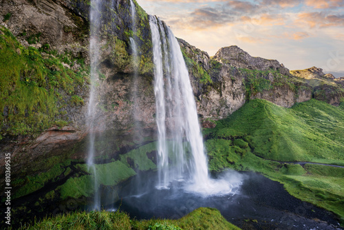 Majestic waterfall in lush green landscape