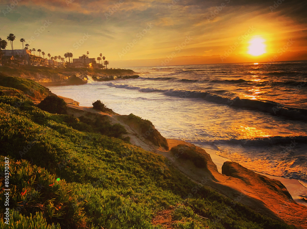 Golden sunset over coastal cliffs