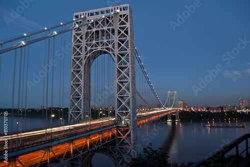 Twilight glow on city suspension bridge © Bryan