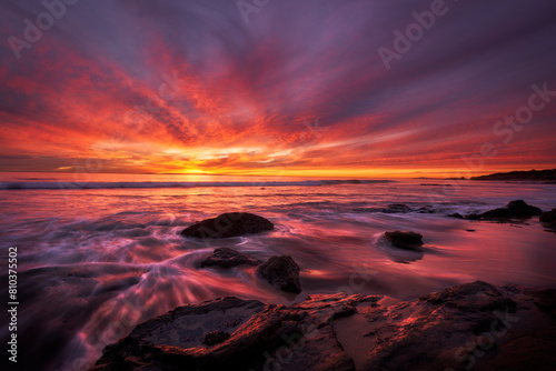 Majestic sunset over rocky shoreline