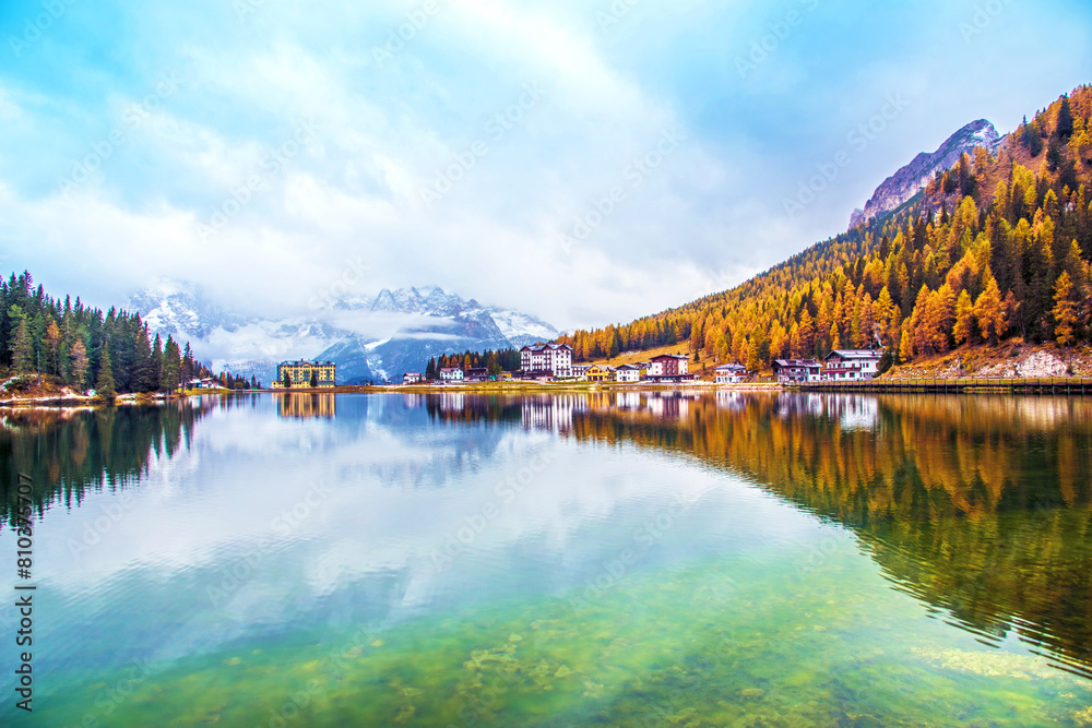 Serene alpine lake with autumn foliage