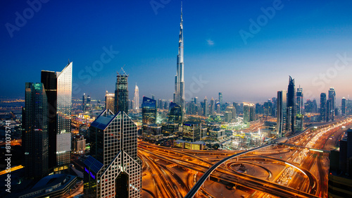 Twilight over dubai skyline with iconic burj khalifa photo