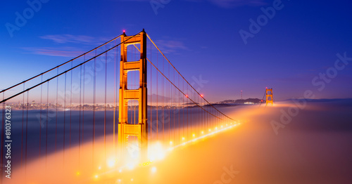 Golden gate bridge shrouded in mist at twilight