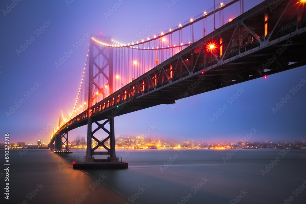 Twilight glow over city bridge