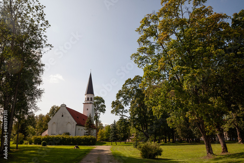 Panorama of the Sigulda evangelical lutheran church, or Siguldas Evaņgeliski luteriska baznica, in the middle of a green park in summer. It's a major protestant lutheran church of latvia. photo