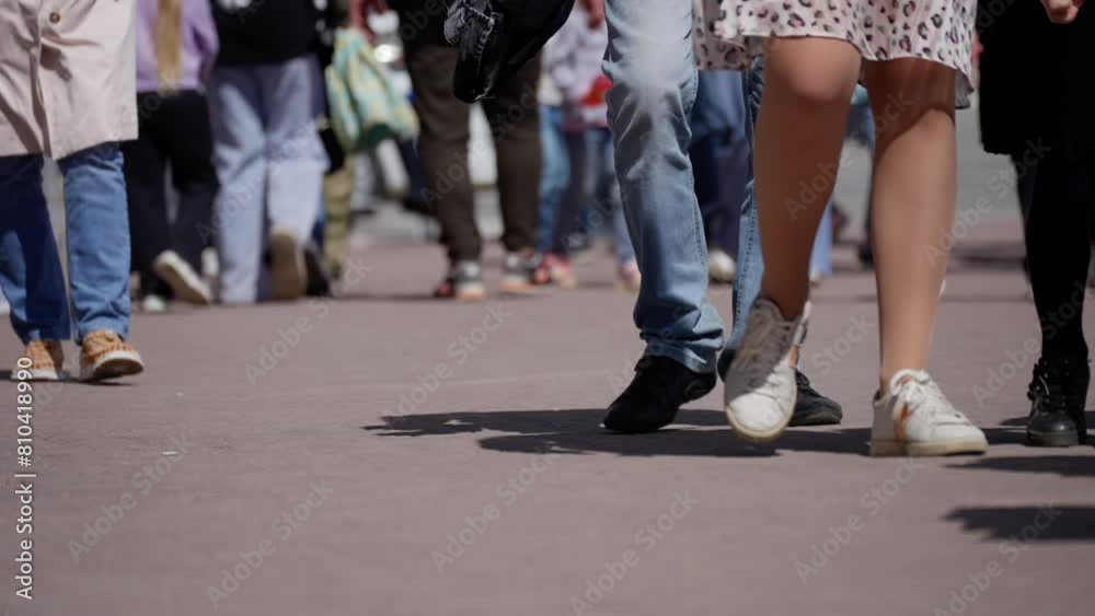 Detailed view of young children walking on a city street, focusing on their lower bodies and casual footwear Detailed view of young children walking on a city street, focusing on their lower bodies and casual footwear